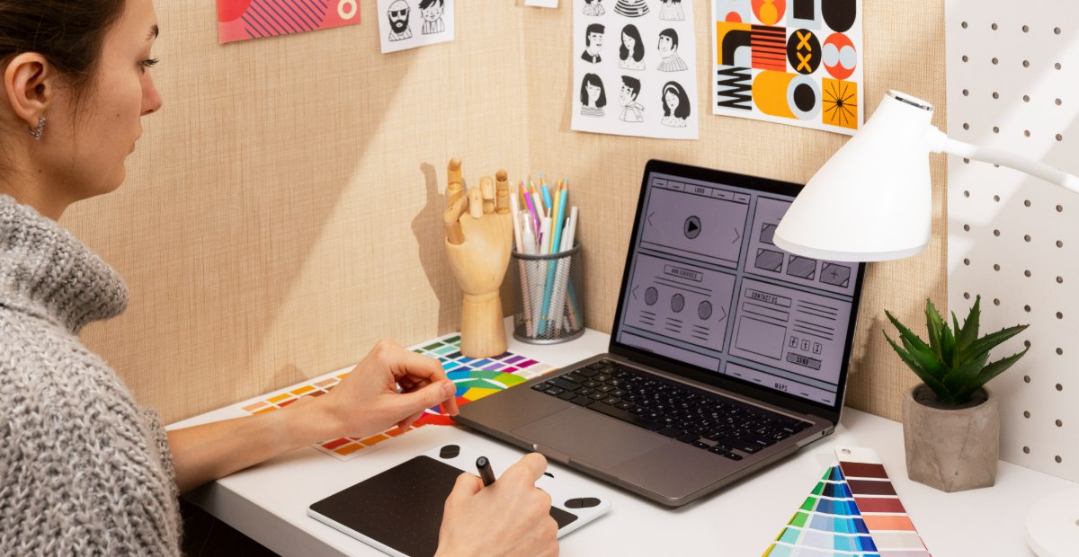 digital professional working on laptop working on a wireframe